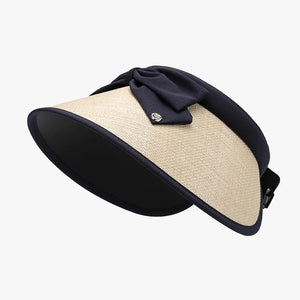 Bow-adorned raffia visor with dark blue trim and bow detail