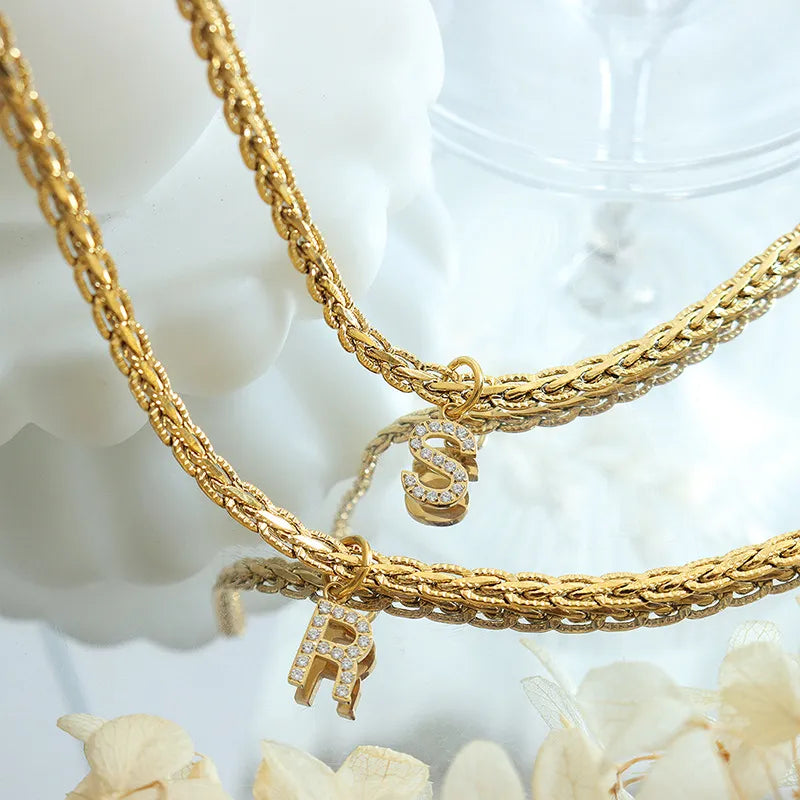 Gold chain necklace with diamond initial pendants R and S