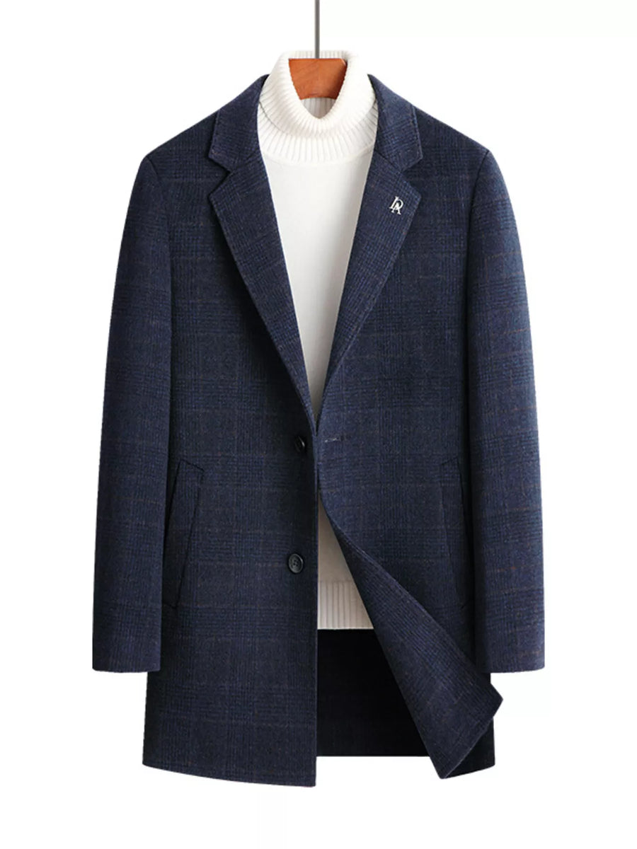 Navy plaid wool blend overcoat with button front and lapel detail.