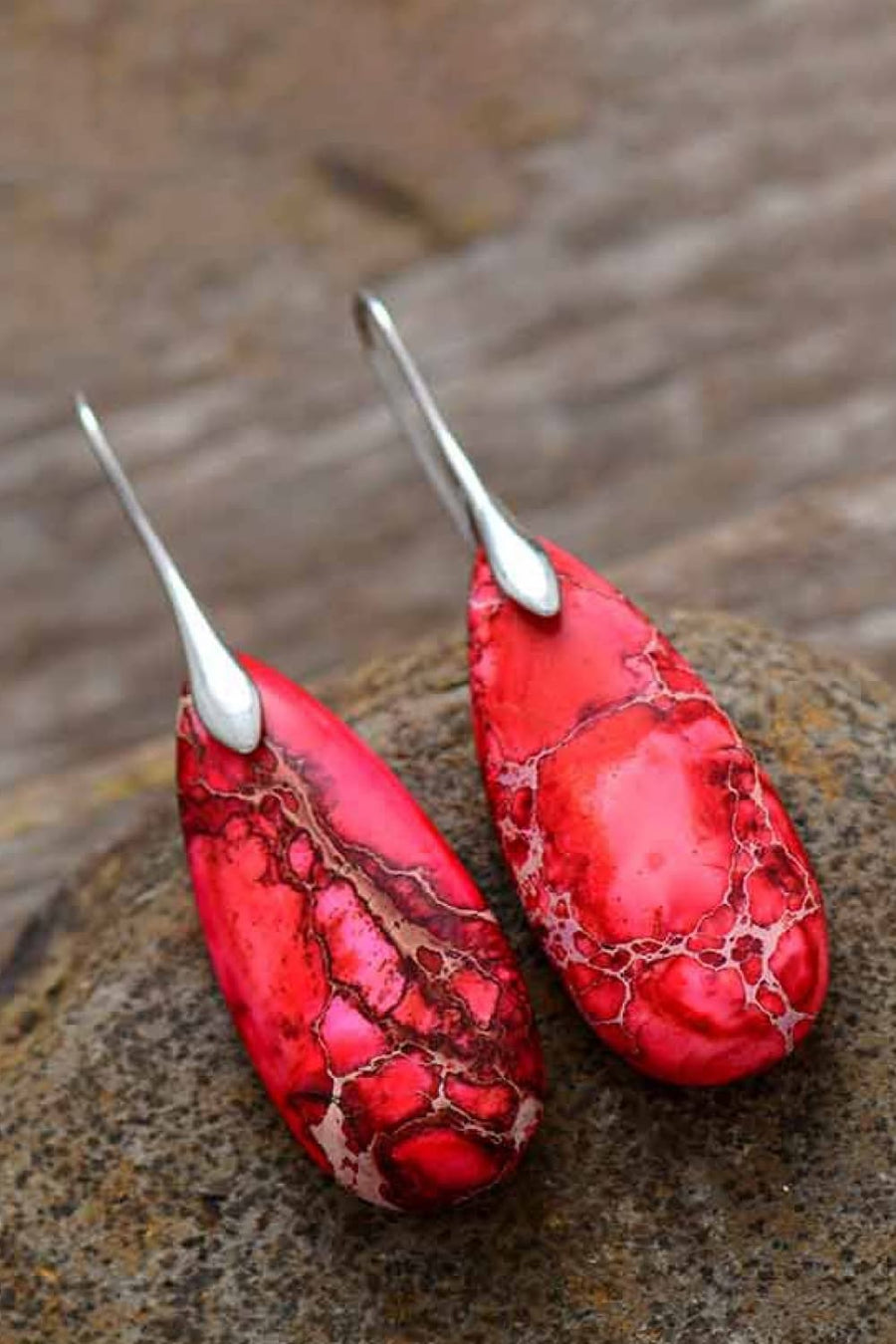 Ocean Jasper dangle earrings in red with silver hooks and unique marbled pattern.