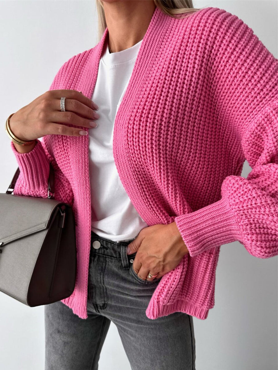 Hot Pink textured puff sleeve cardigan with ribbed cuffs and open front.
