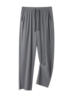 Men's grey sweatpants with drawstring waist and pockets.