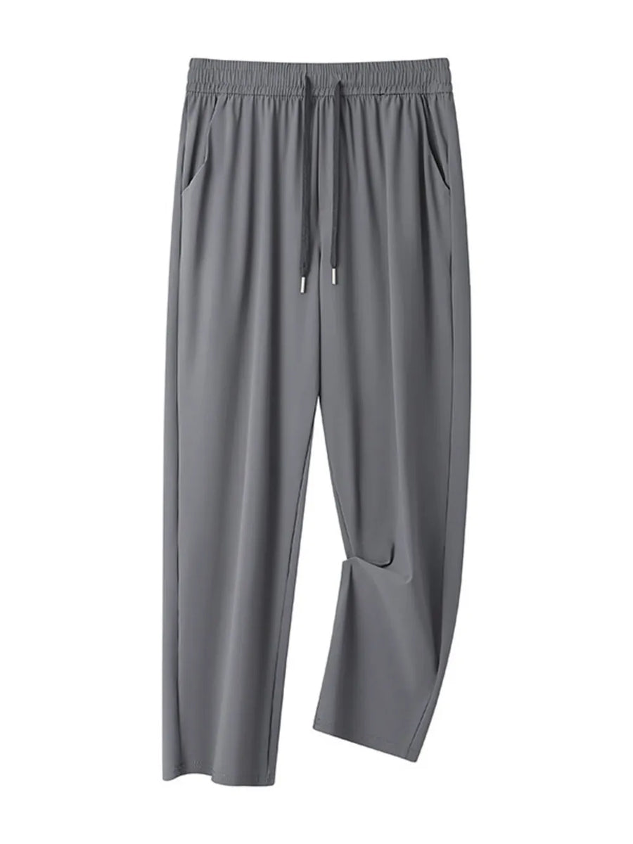 Men's grey sweatpants with drawstring waist and pockets.