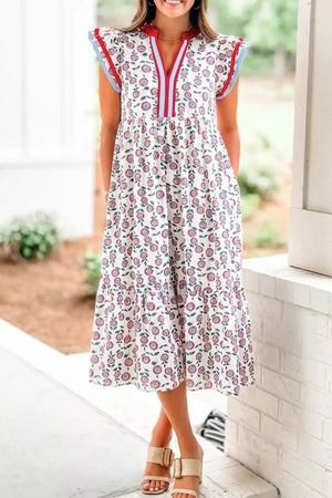 Vibrant floral tiered midi dress with V-neck and short sleeves, made of cotton.