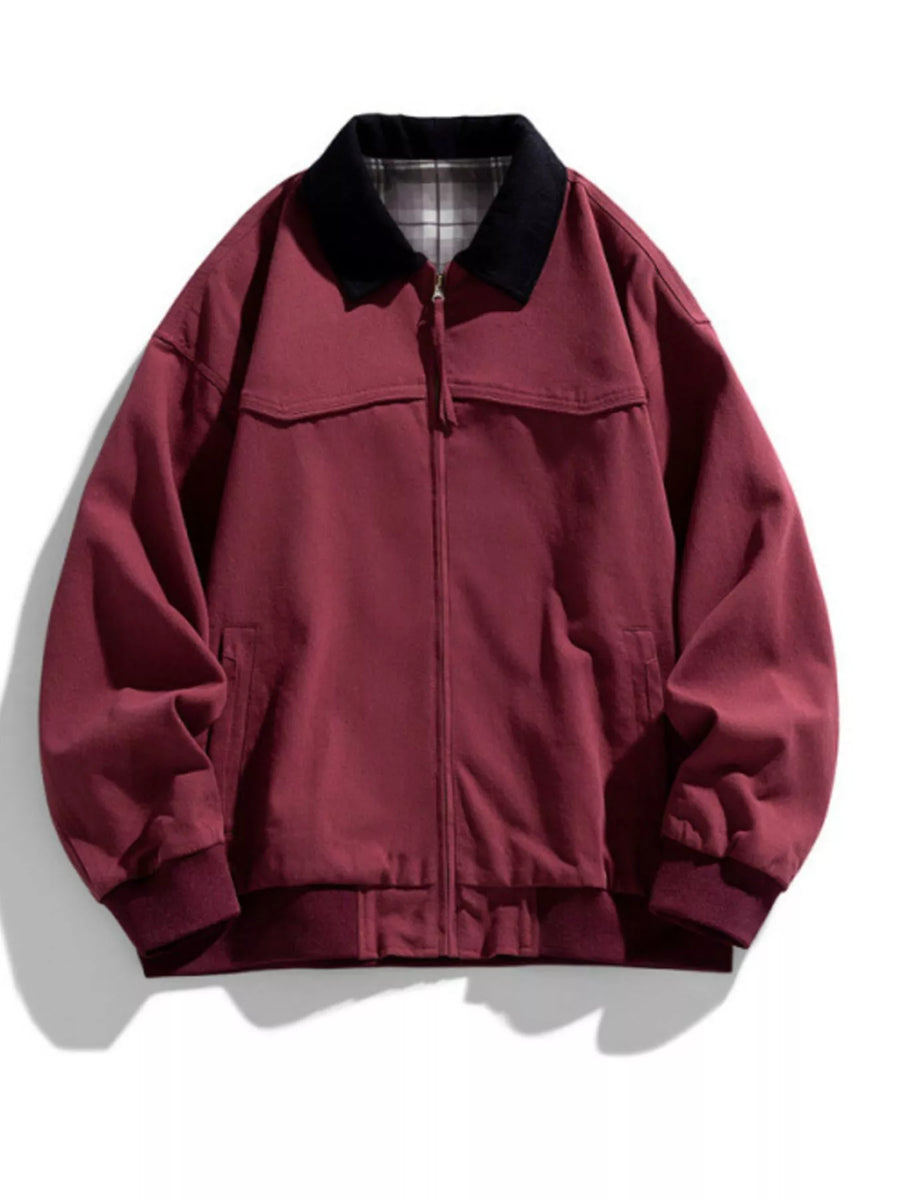 Oversized zip-up jacket in Sauce Fruit Red with a black collar and plaid lining.