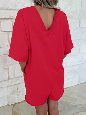 Scarlet cotton romper with V-neck, half sleeves, and pockets.