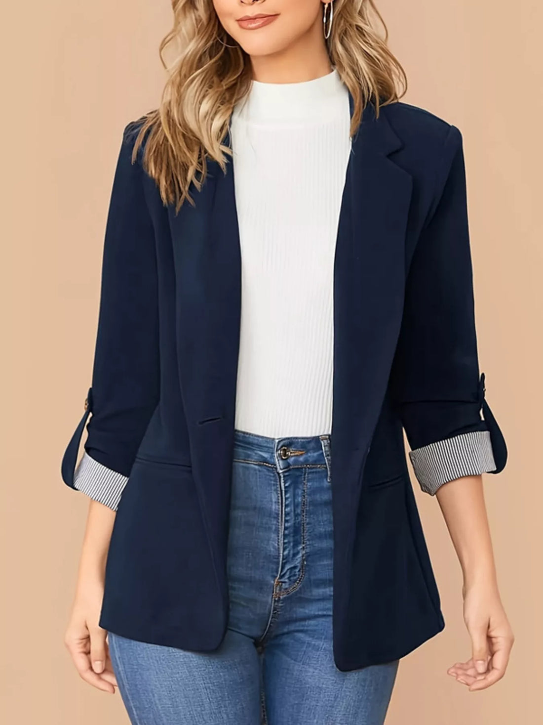 Navy blue blazer with roll-up sleeves featuring striped cuffs, single button closure.