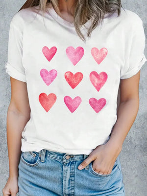 White t-shirt with watercolor heart graphic.