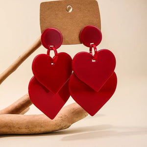 earrings in red with drop design and drop