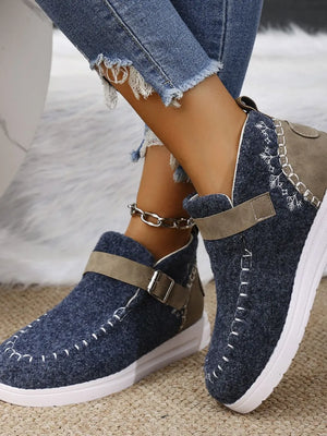 Textured stitch-detail buckle sneakers in dusty blue with contrasting tan accents and white stitching.