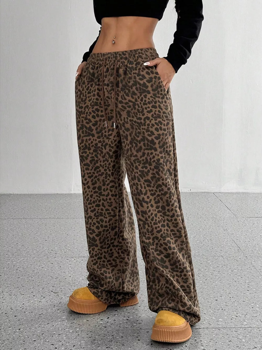 wide-leg pants in brown featuring drawstring waist and flared fit