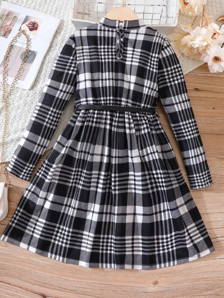 Black and white plaid long-sleeve belted dress with a high neckline and flared skirt.