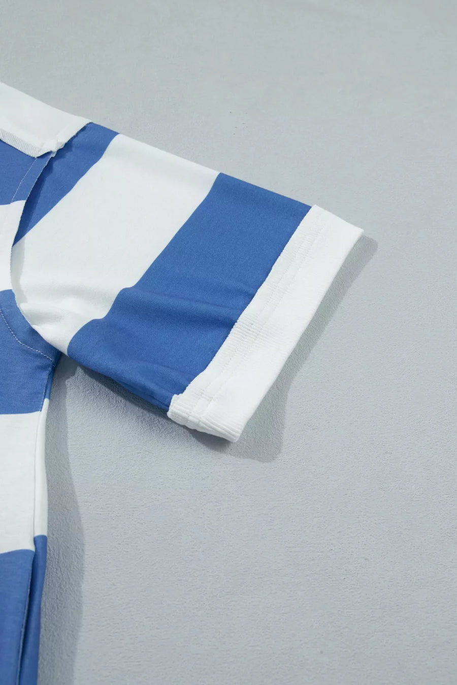 T-shirt dress with blue and white stripes, short sleeves, and a ribbed cuff detail.