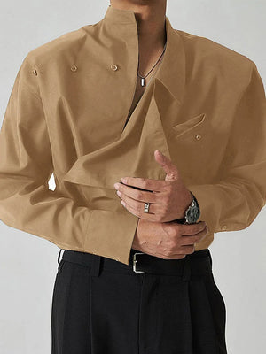 Camel long sleeve shirt with architectural collar and asymmetric button detail.