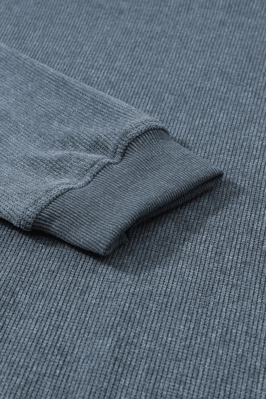 Textured ribbed crewneck pullover in Dusty Blue with ribbed cuffs and hem detail.