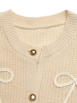 Ribbed knit cardigan in khaki with button-up front and braided bow details.