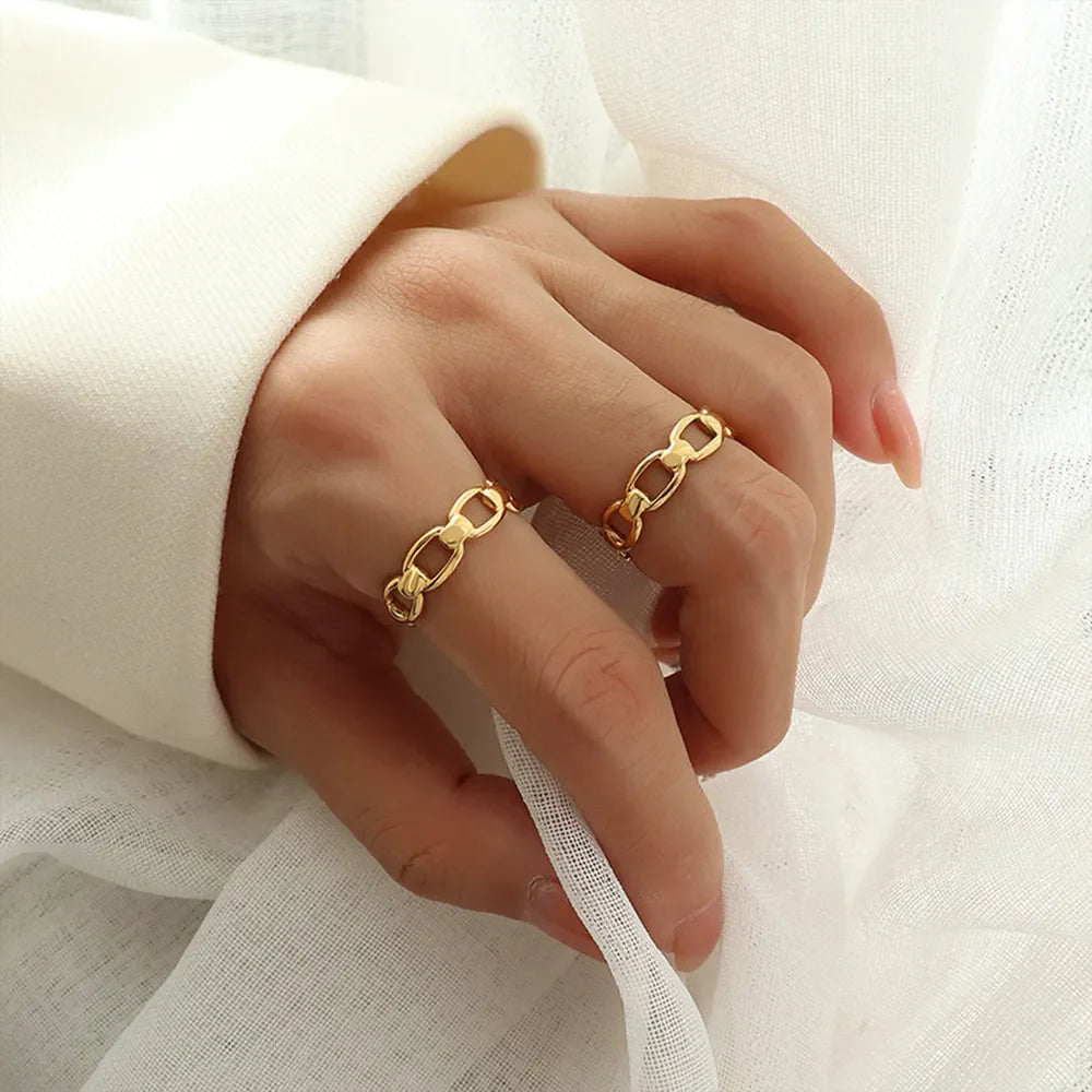 Gold chain link adjustable ring with 18K gold finish.