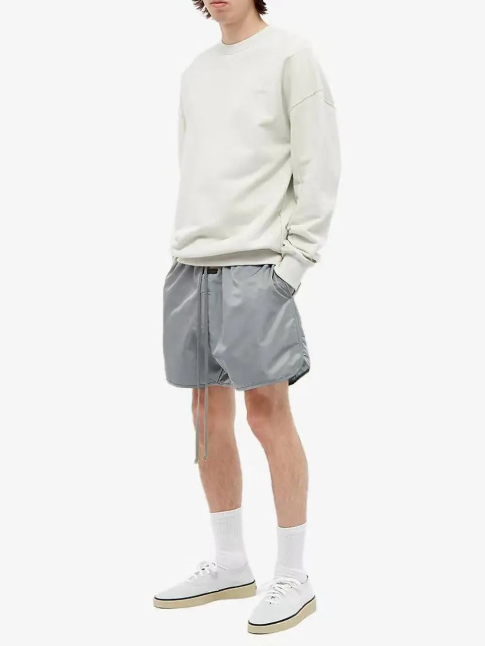 Nylon drawstring shorts in Taupe with curved hem detail and adjustable tie waist.