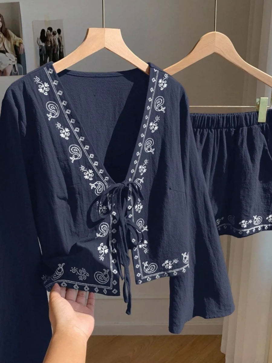 Navy embroidered tie-front top and shorts set with white paisley pattern.