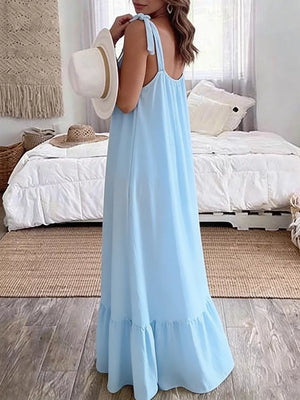 Sky blue maxi dress with tie straps and ruffled hem, flowing casual style.