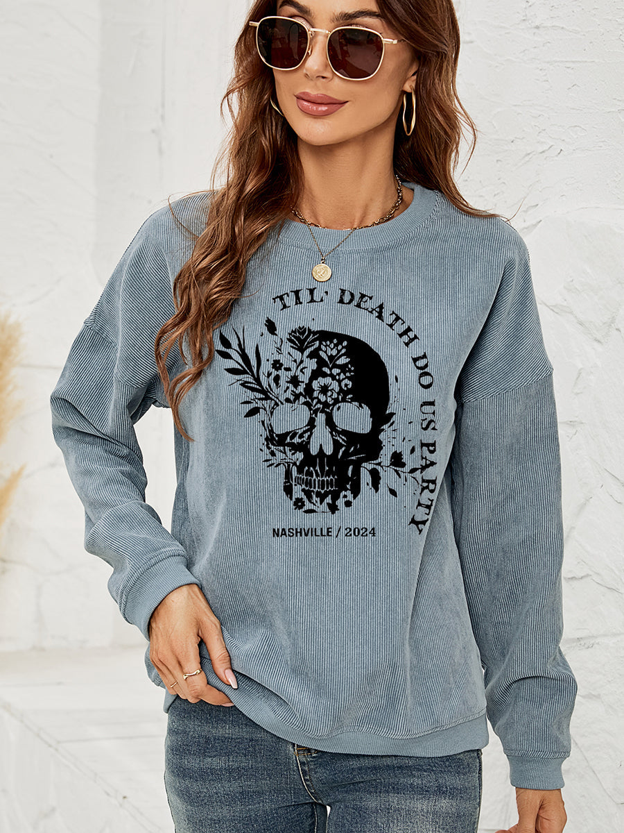 French Blue corduroy sweatshirt with a skull and floral graphic and text.