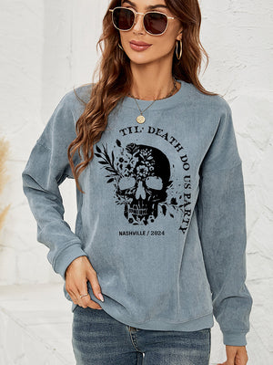 French Blue corduroy sweatshirt with a skull and floral graphic and text.