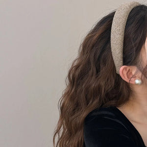 Textured tweed padded headband in Khaki with herringbone pattern.