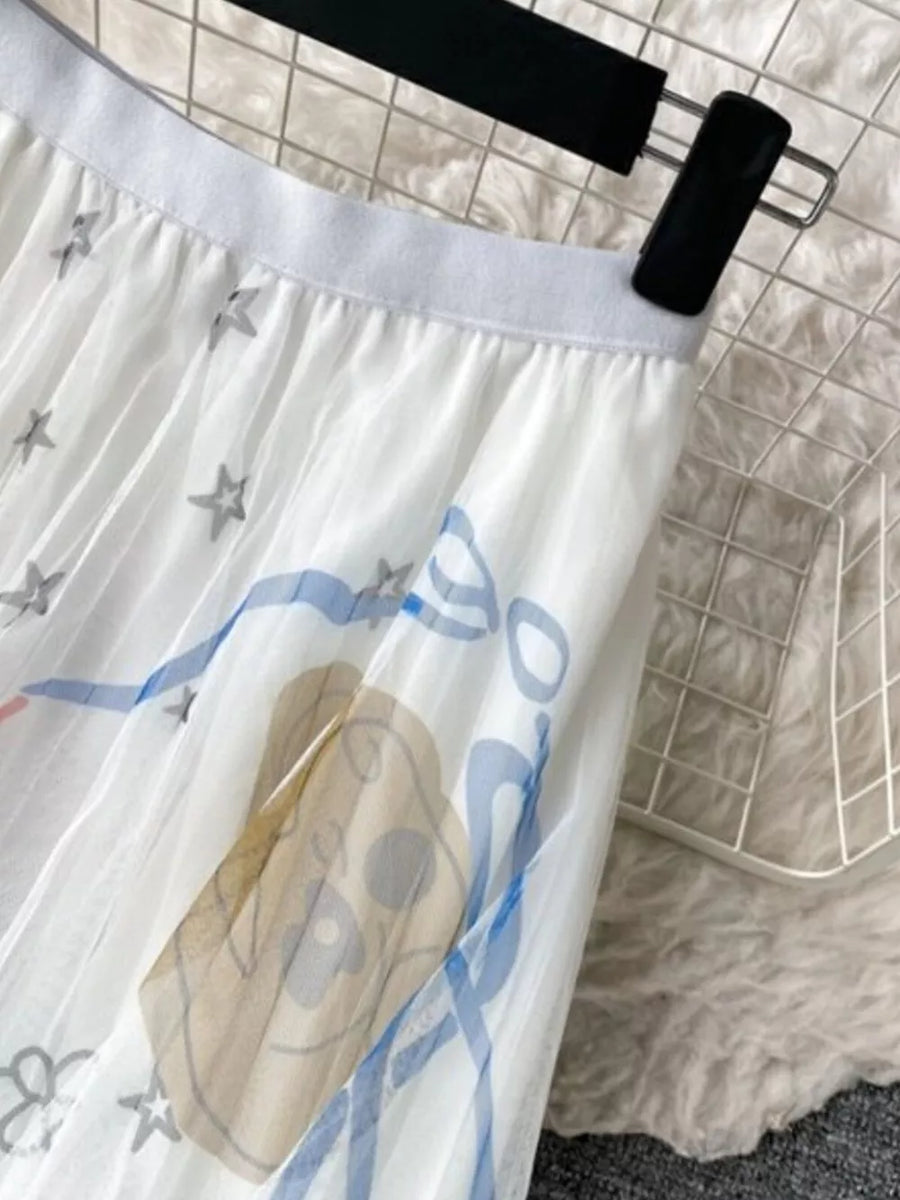 White tulle skirt with abstract sunburst print and stars.