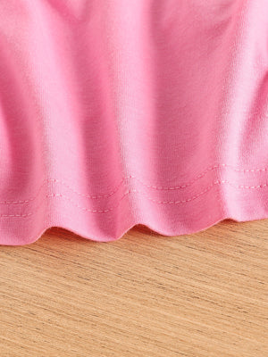 Pink toddler crop top hem detail, cotton blend fabric with double stitching.