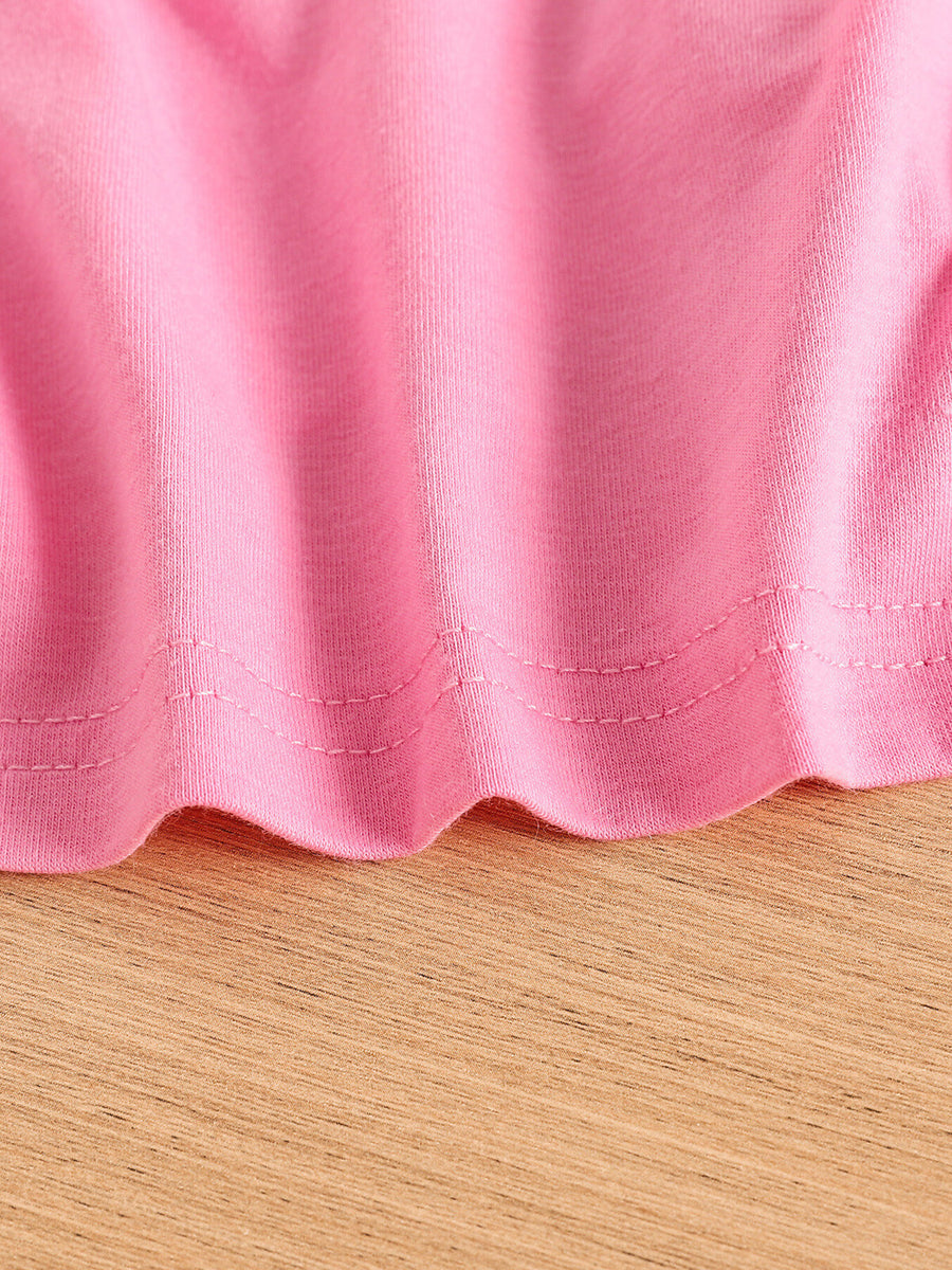Pink toddler crop top hem detail, cotton blend fabric with double stitching.