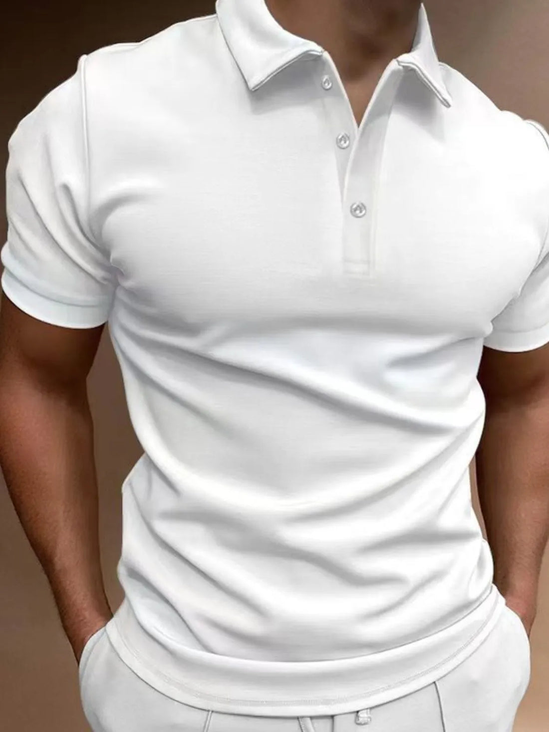 White athletic fit polo shirt with short sleeves and a buttoned collar.