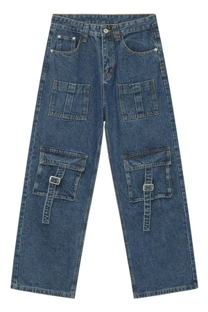 Medium wash denim cargo pants with buckle flap pockets and wide leg cut.