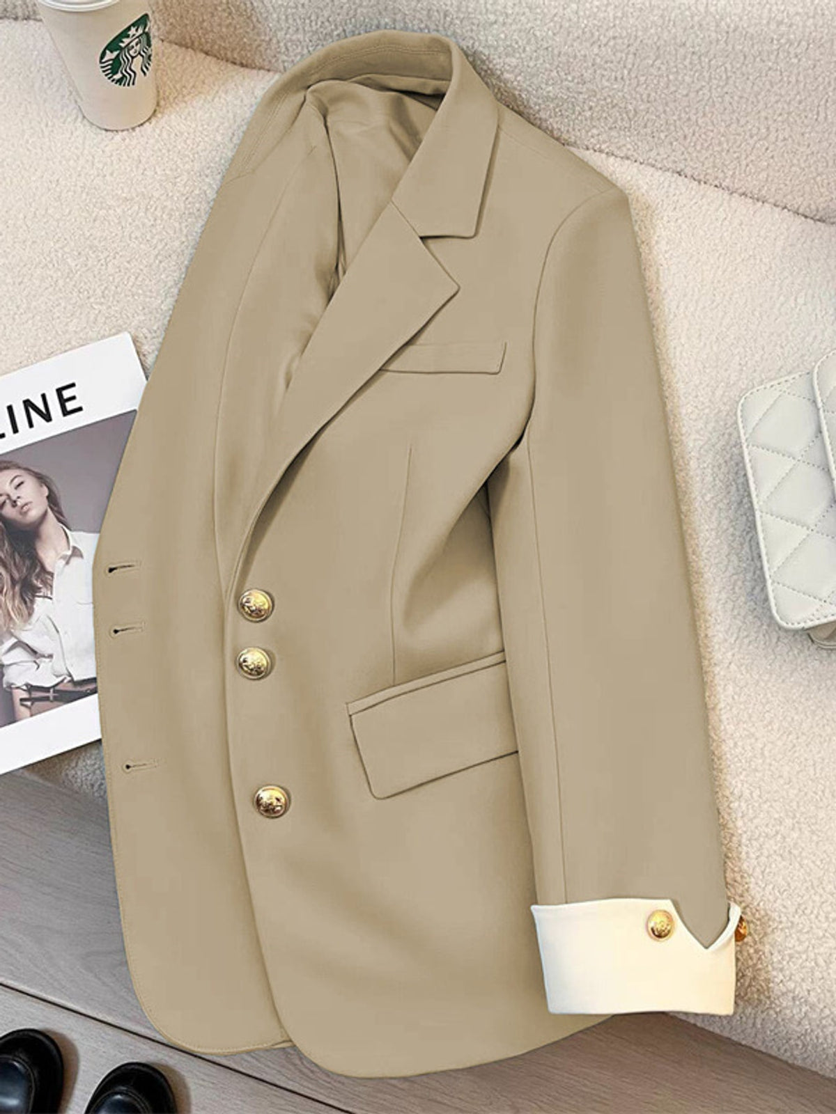 cream blazer with hip-length and button-front