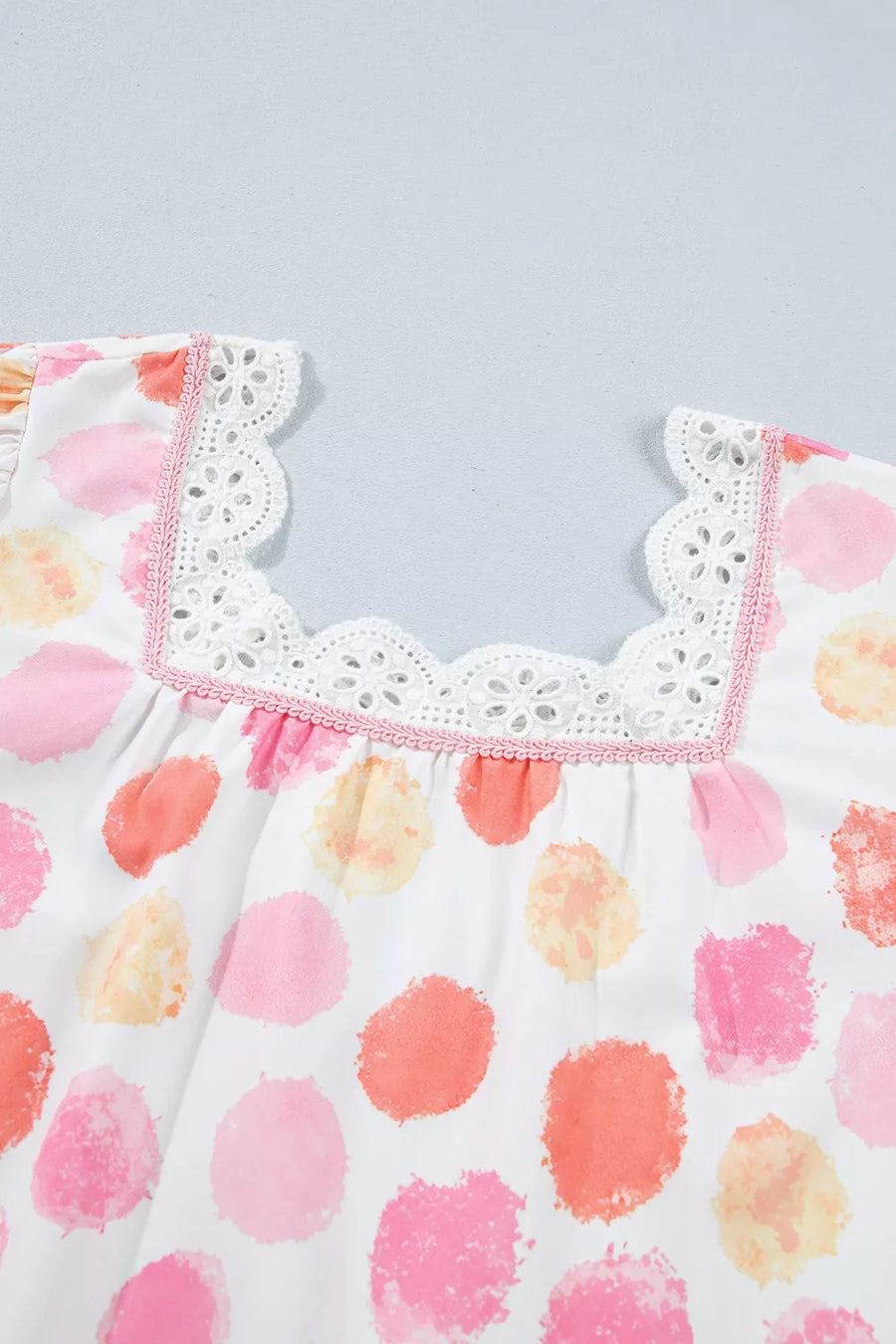 Blouse with watercolor polka dots, square neckline, white eyelet lace trim and pink piping.