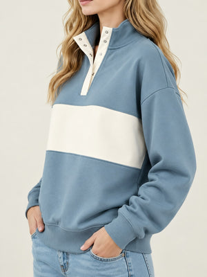 Peacock Blue sweatshirt with half-button and color-block, abstract-print