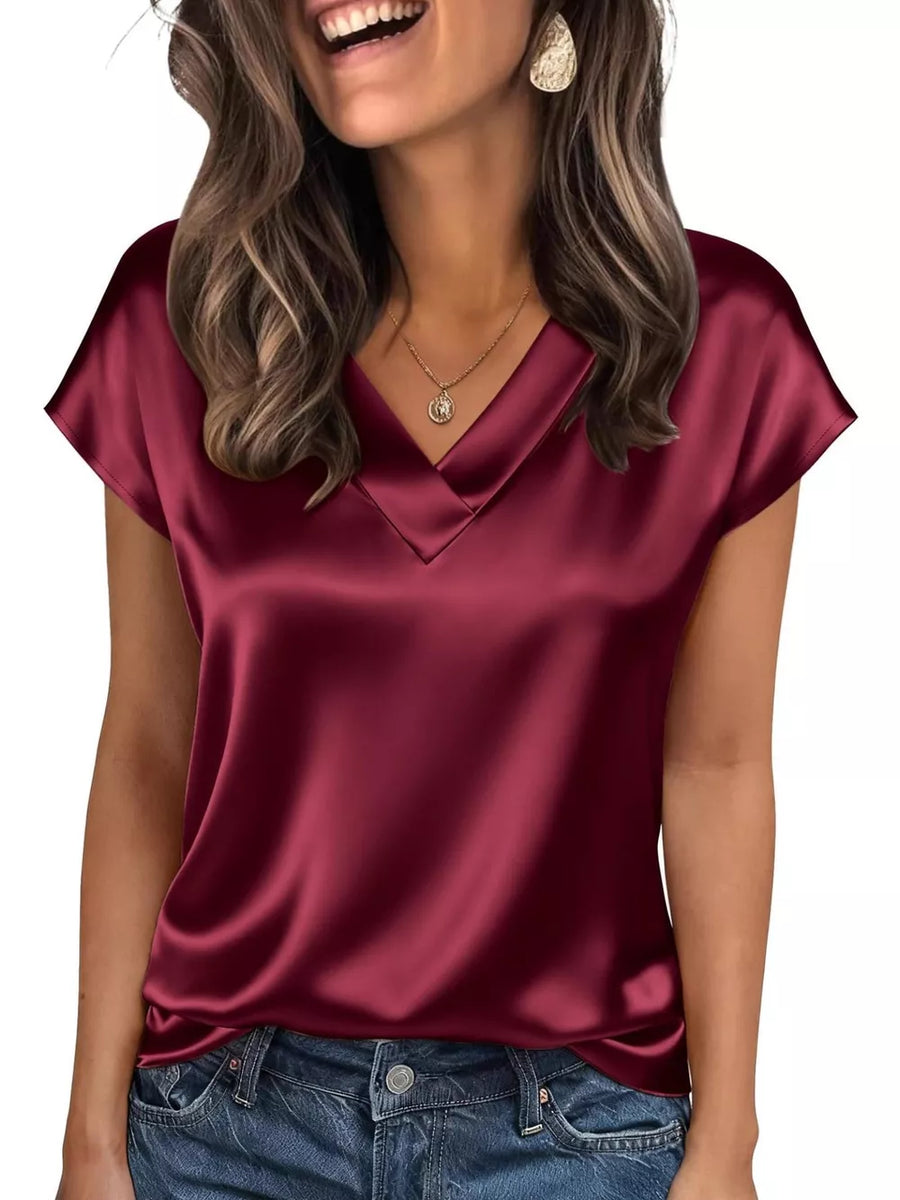 Wine red satin V-neck blouse with short sleeves and a lustrous finish.
