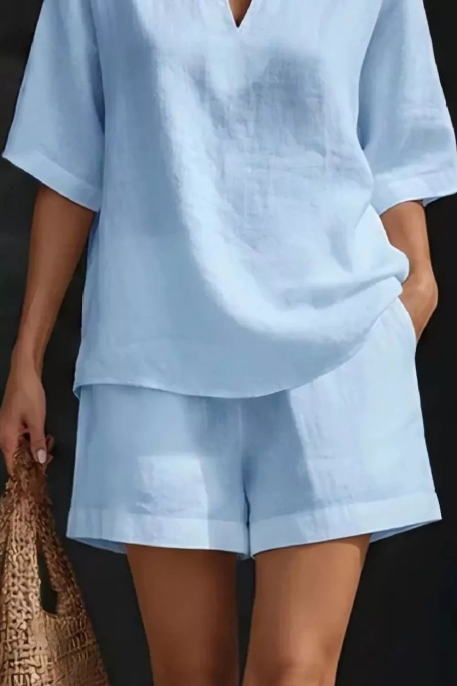 Light blue notched top and pocketed shorts set, comfortable loungewear for women.