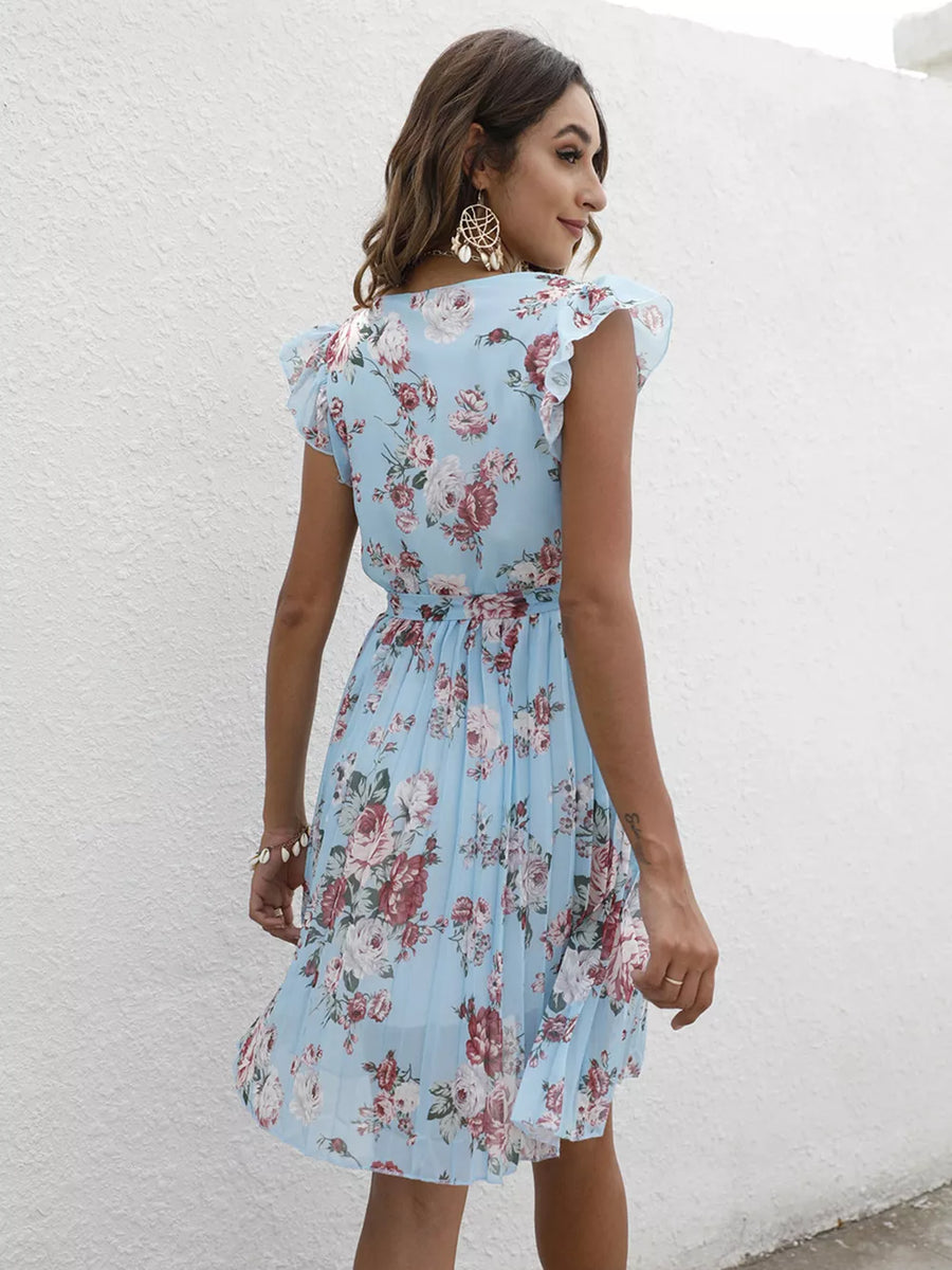 Light blue floral pleated dress with ruffle sleeves and a belted waist.