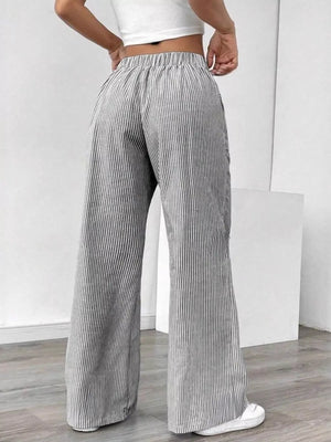 100% polyester Care instructions: Machine wash cold wide-leg pants in Light Gray with flared silhouette