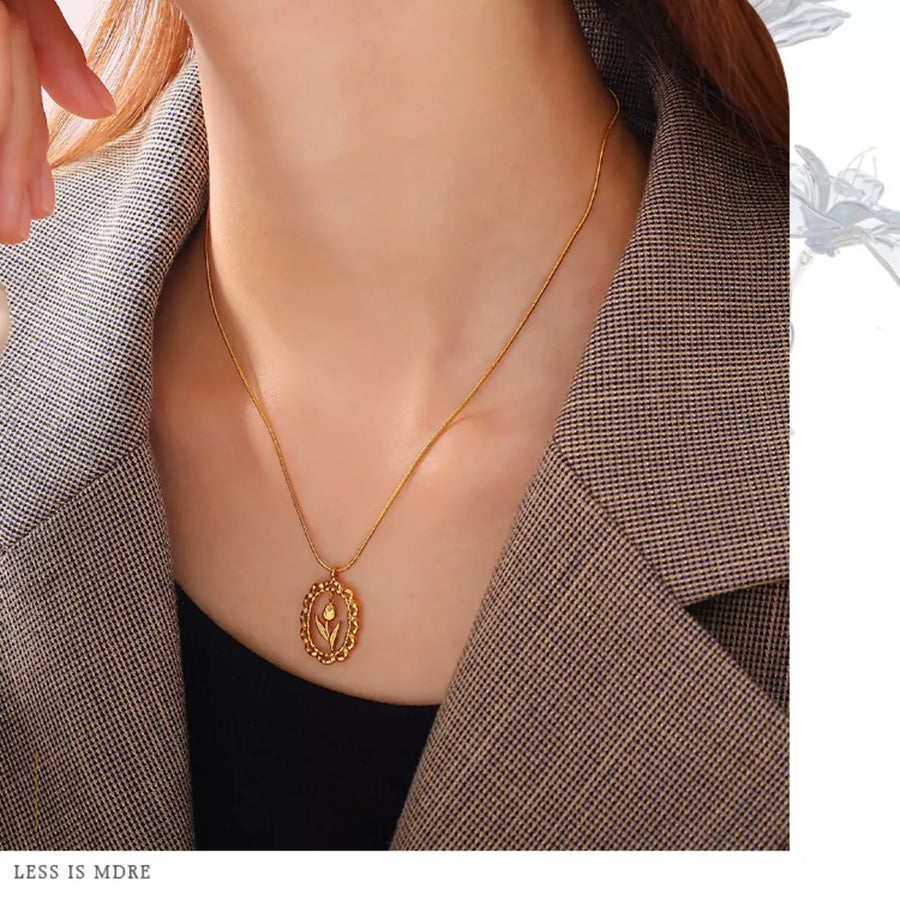 White necklace featuring pendant and floral