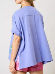 Blue polyester t-shirt with flip-flop embroidery detail on sleeve.