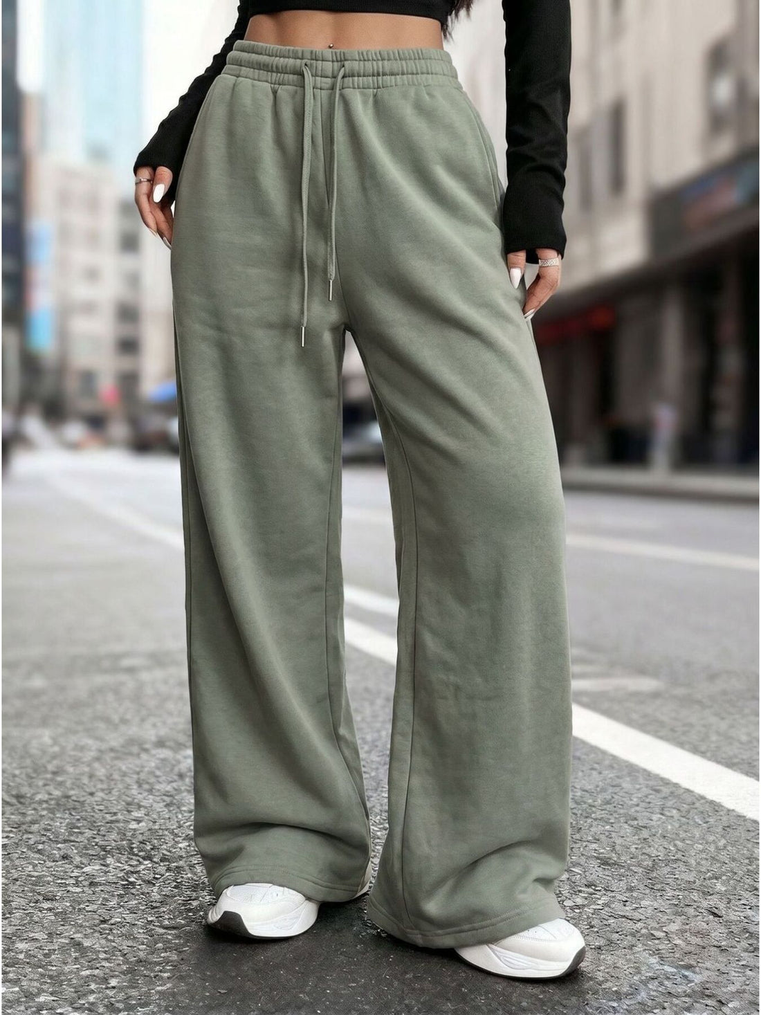 sweatpants in sage green featuring drawstring waist and wide-leg fit