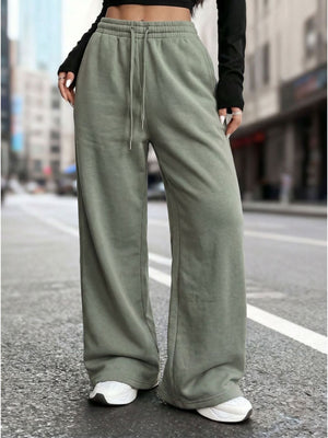 sweatpants in sage green featuring drawstring waist and wide-leg fit