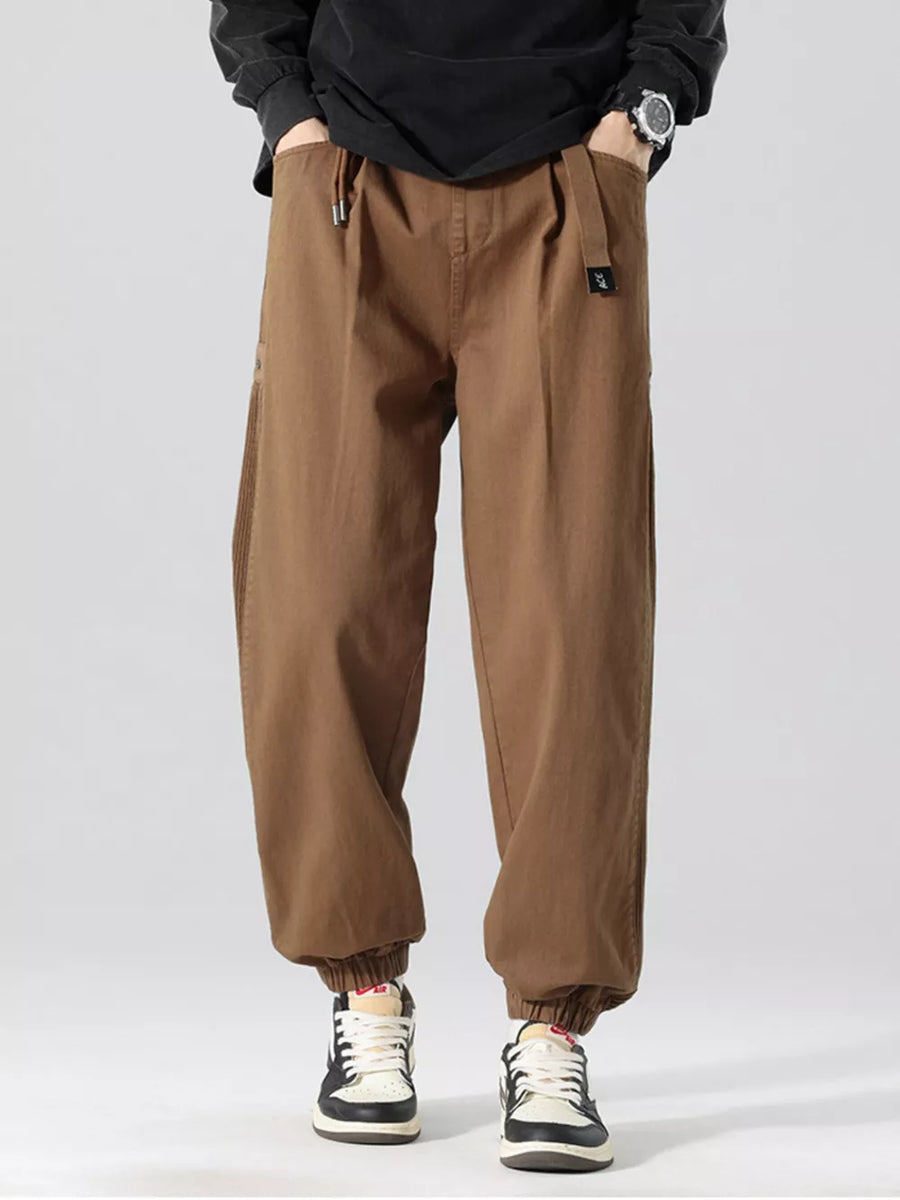 Oversized coffee cargo joggers with drawstring waist and elastic cuffs.