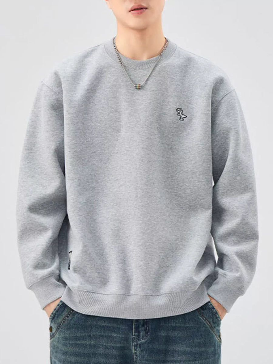 Gray sweatshirt with crew neck, long sleeves, and embroidered dinosaur detail.