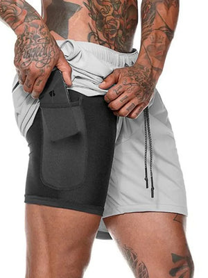 Gray dual-layer performance shorts with built-in compression liner and phone pocket