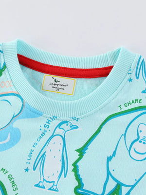 Mint blue cotton blend sweatshirt with playful animal print and red neckline trim.