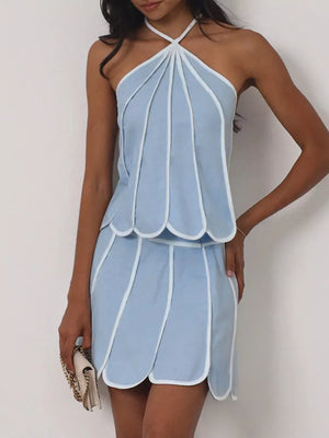 Light blue halter top and mini skirt set with white piping and petal-like details