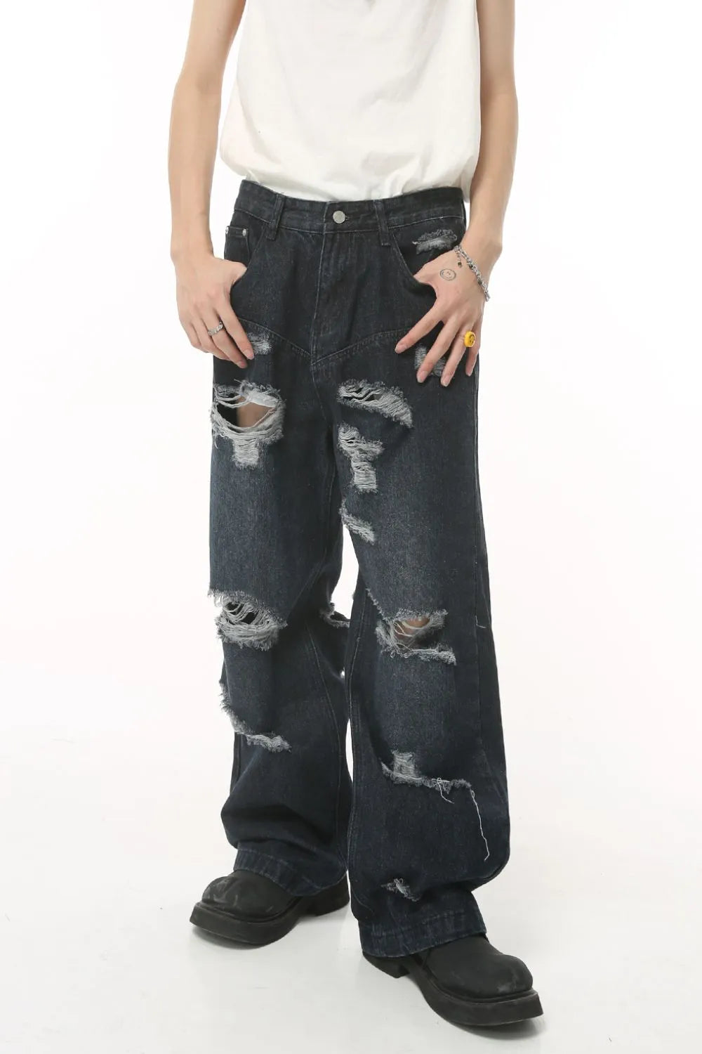 Distressed baggy dark denim jeans with statement rips and a comfortable cotton feel.
