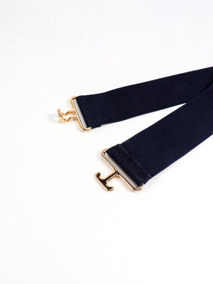 Dark blue elastic belt with gold hook and loop buckle closure
